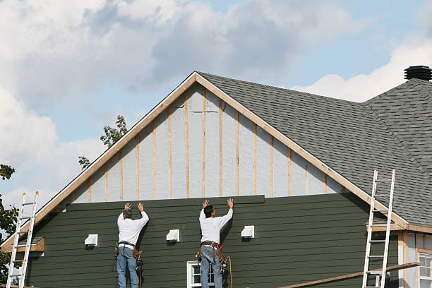 Professional Storm Damage Siding Repair technician working in Dresden, OH